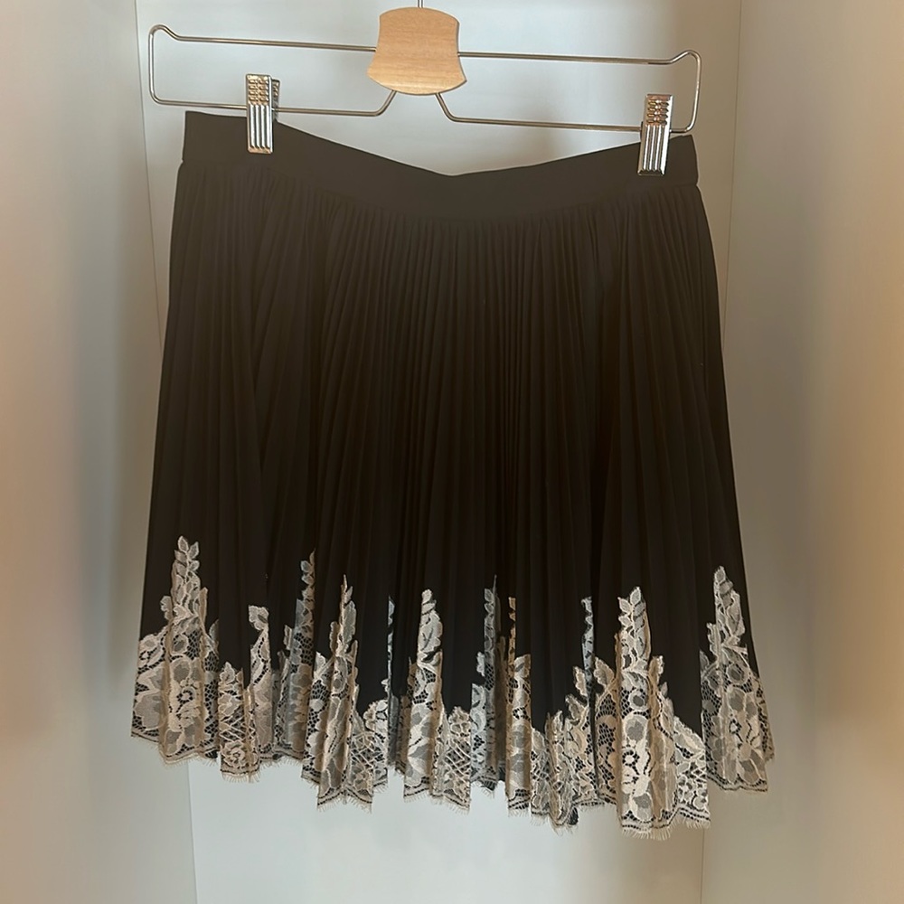Robert Rodriguez black pleated skirt with with white lace bottom trim